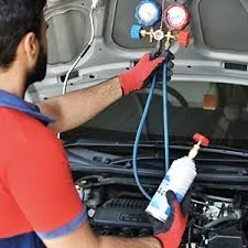 Technician performing car AC gas refilling and repair service in Panchkula