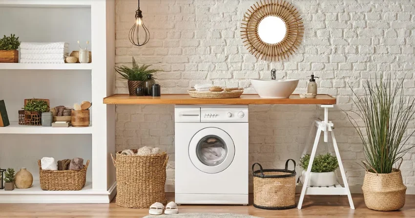 Modern front load washing machine in stylish laundry room setting